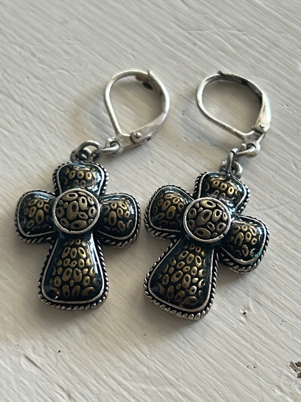 Silver toned cross with gold enamel lever back earrings